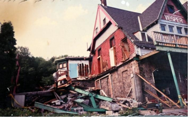 The Singles bay 1946 & 1964 additions were demolished re-exposing colored glass panels above closed off doors.
